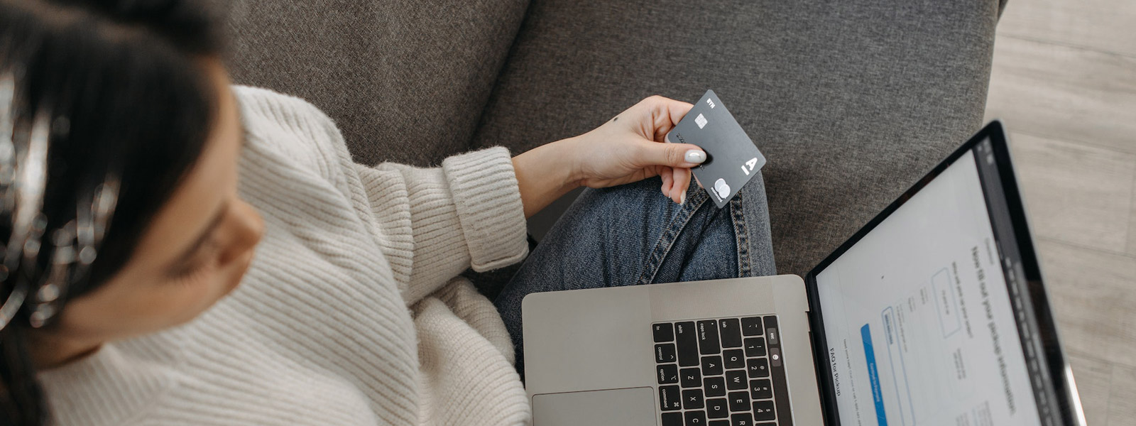 Woman holding credit card for online payment